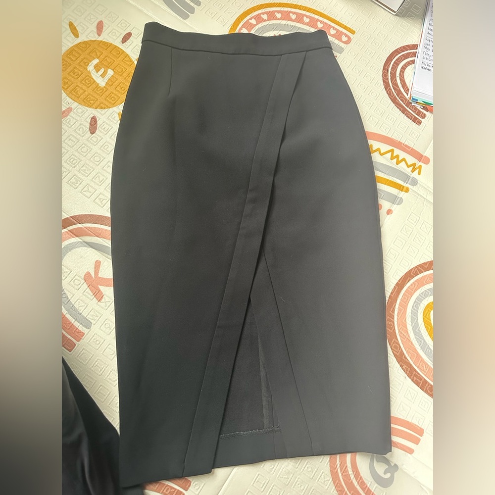 Nicholas black skirt with asymmetrical cut on bottom size S, zipper back